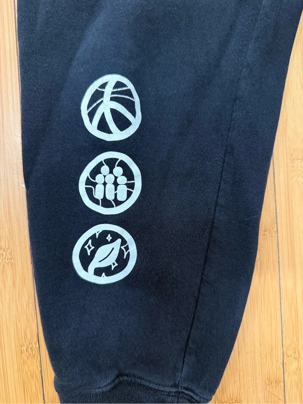 Nike Kids Black Sweatpants with White Logo and Graphic Icons,size small